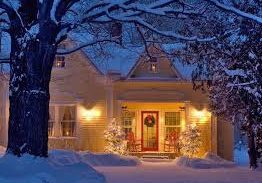 A house is covered with snow located in Lakeville